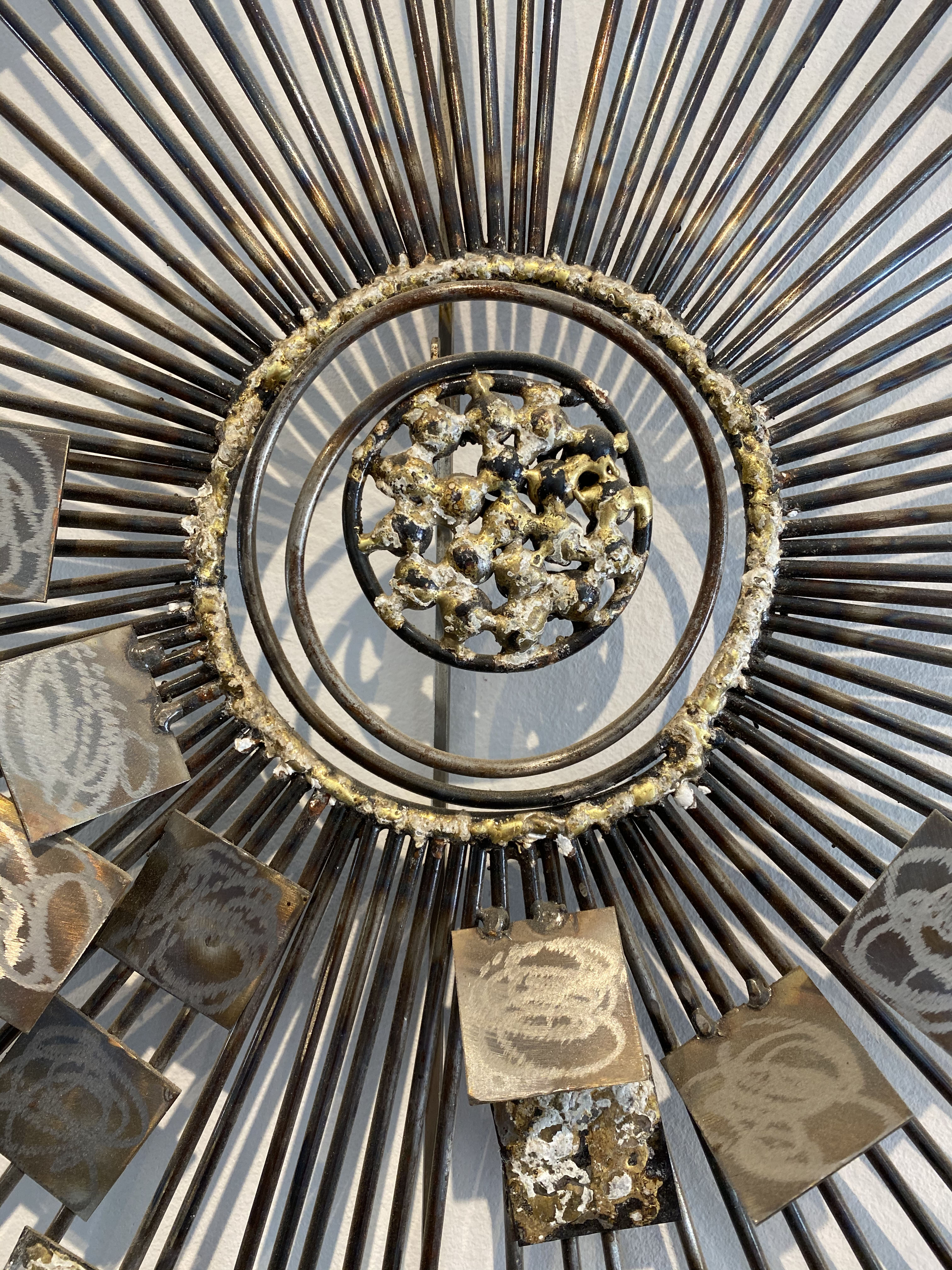 Brutalist Sunburst wall sculpture by Curtis Jere. USA, 2000s