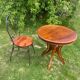 Round table and wrought iron chair