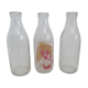 Three vintage glass milk bottles.