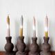 Four vintage handcrafted candle holders