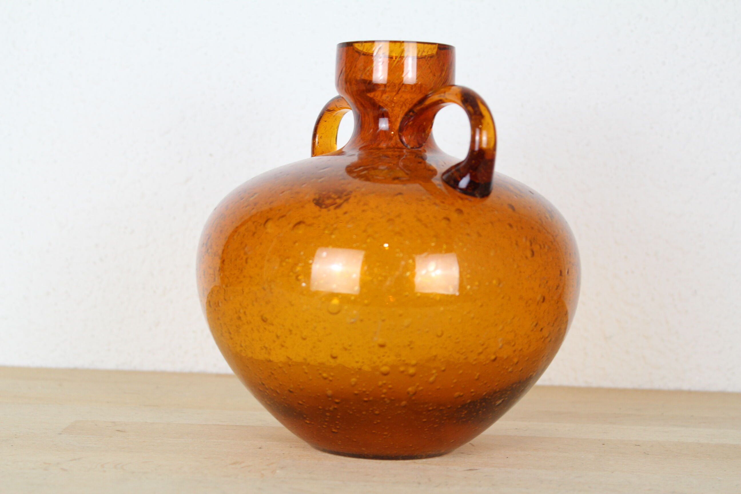 Biot's orange glass vase with orange coves