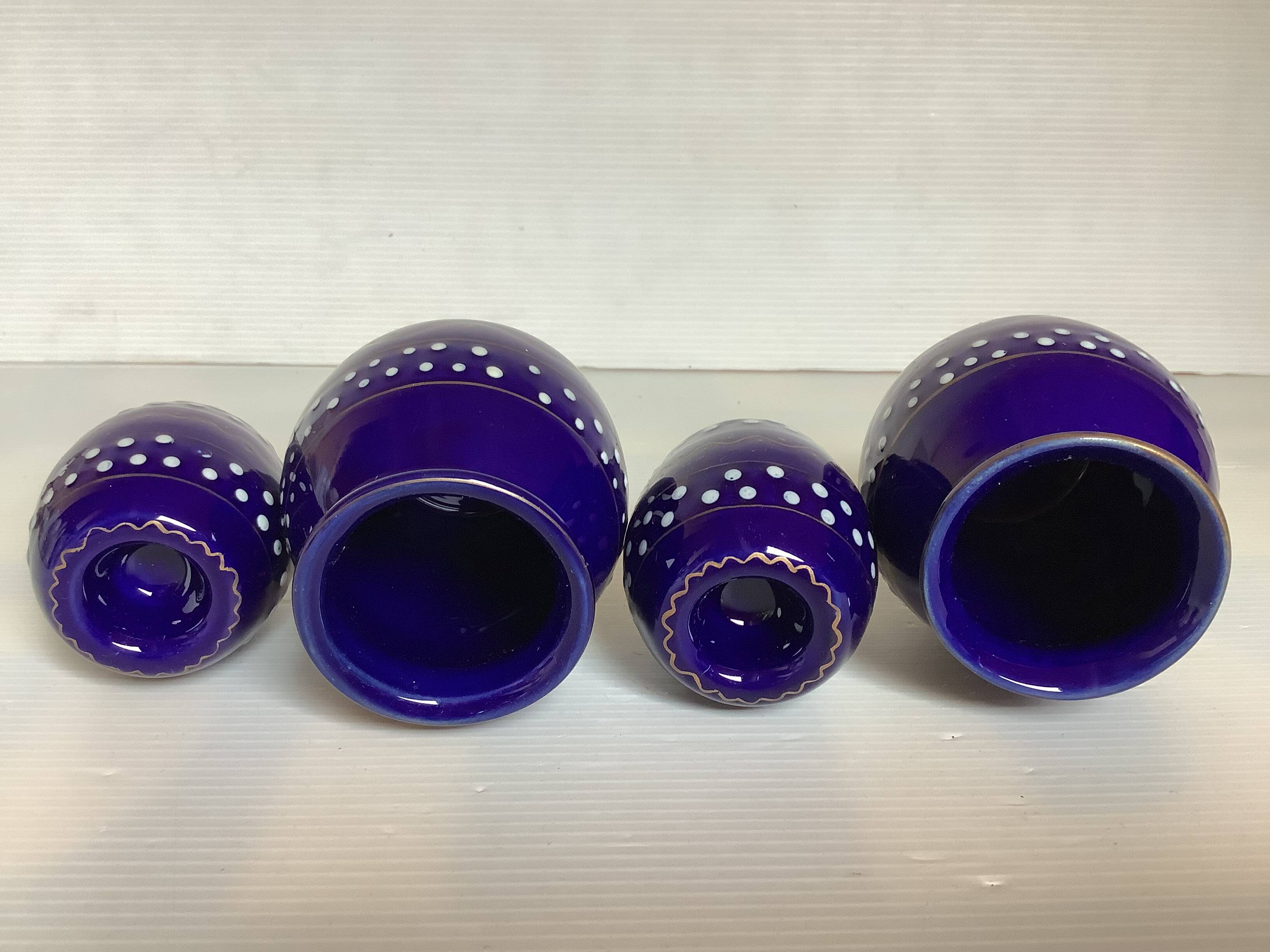 Pair of small enamelled cobalt blue candlesticks and vases