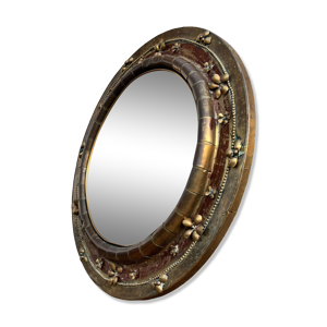 Miroir rond en cuivre travaillé,