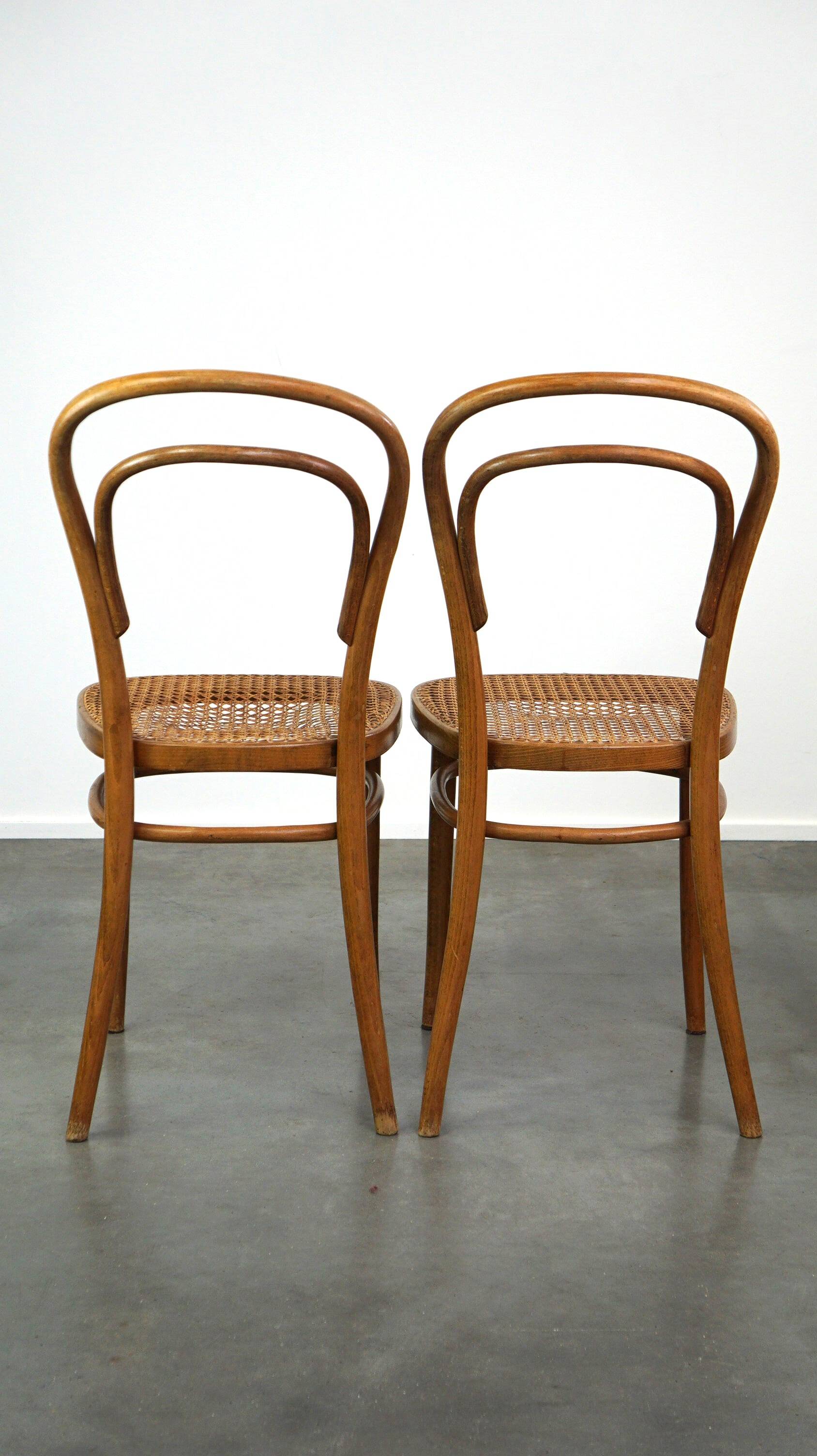 Lovely set of 2 brown vintage bistro chairs with woven seats