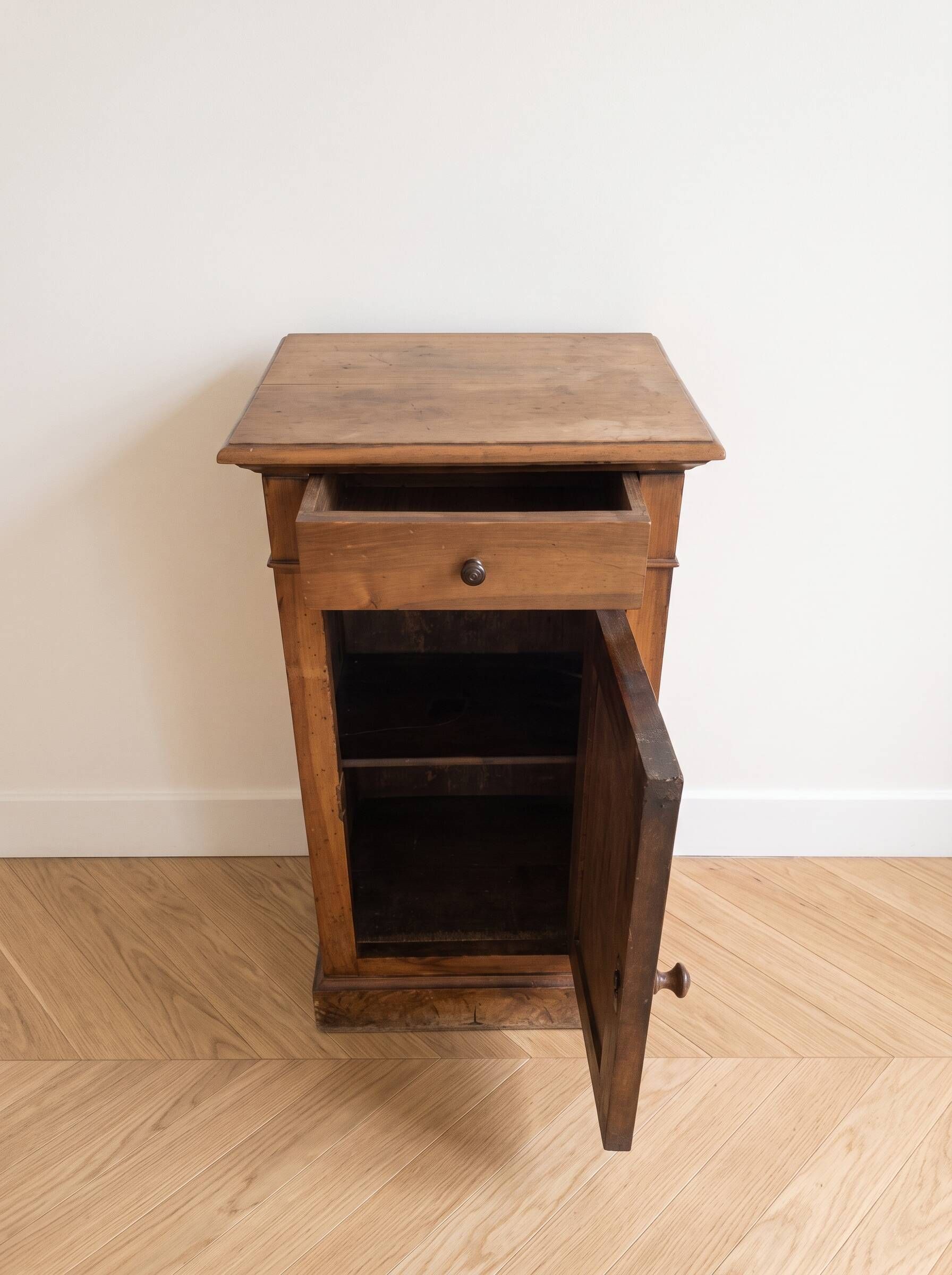 Antique bedside table in waxed wood