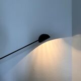 Fase lamp with movable arm