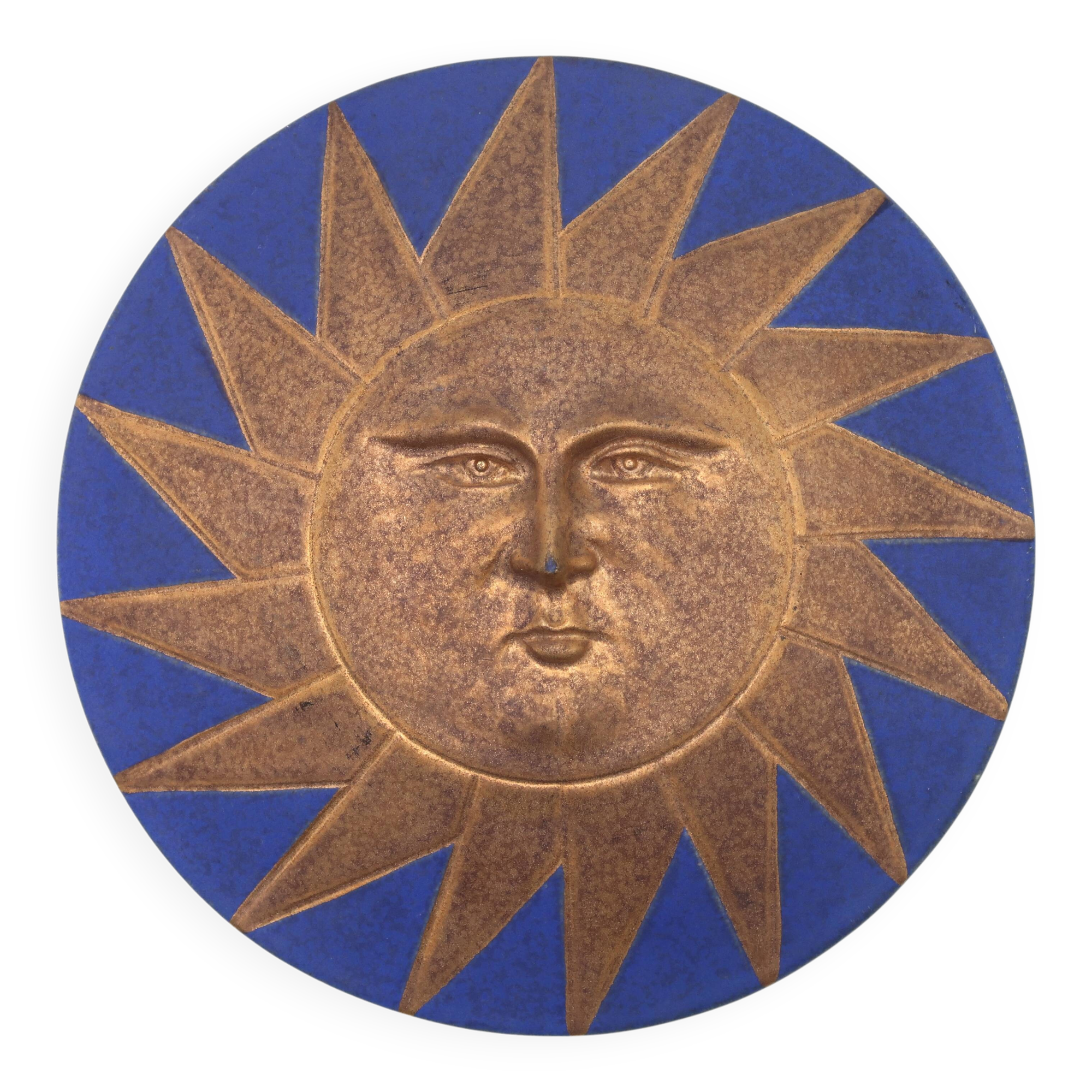 Relief mural signed in ceramic, sun with blue and gold face, 1990s.