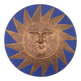 Relief mural signed in ceramic, sun with blue and gold face, 1990s.