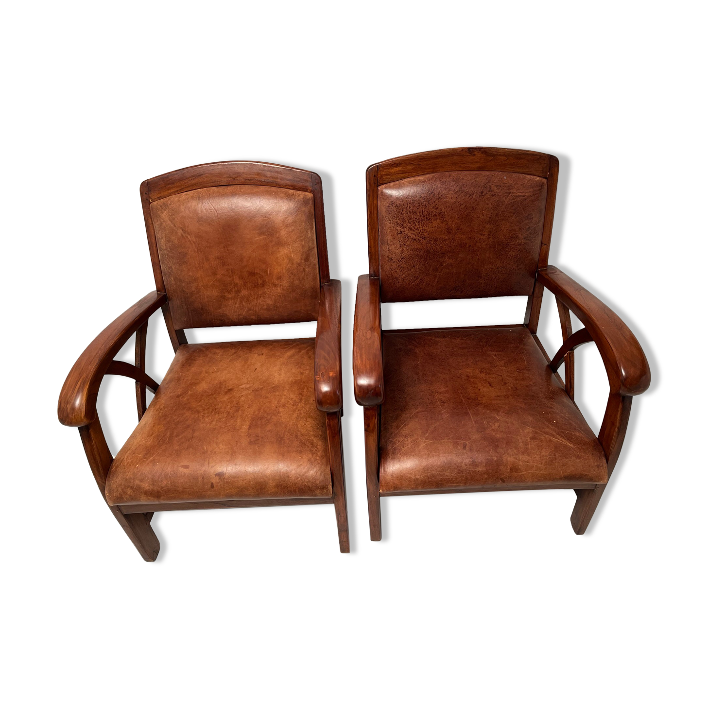 Paire de fauteuils style colonial en tech et cuir vintage