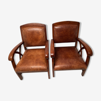Paire de fauteuils style colonial en tech et cuir vintage