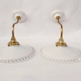 Swan neck sconces in serrated opaline