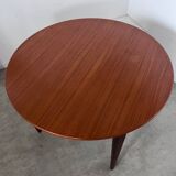 Round teak table with Scandinavian design extensions from the 60s vintage