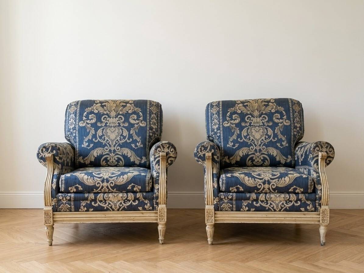 Pair of Armchairs, Louis XVI style, low model, white lacquered, blue fabric with royal decoration.