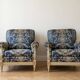Pair of Armchairs, Louis XVI style, low model, white lacquered, blue fabric with royal decoration.