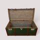 Vintage wooden and metal green travel trunk, circa 1930.