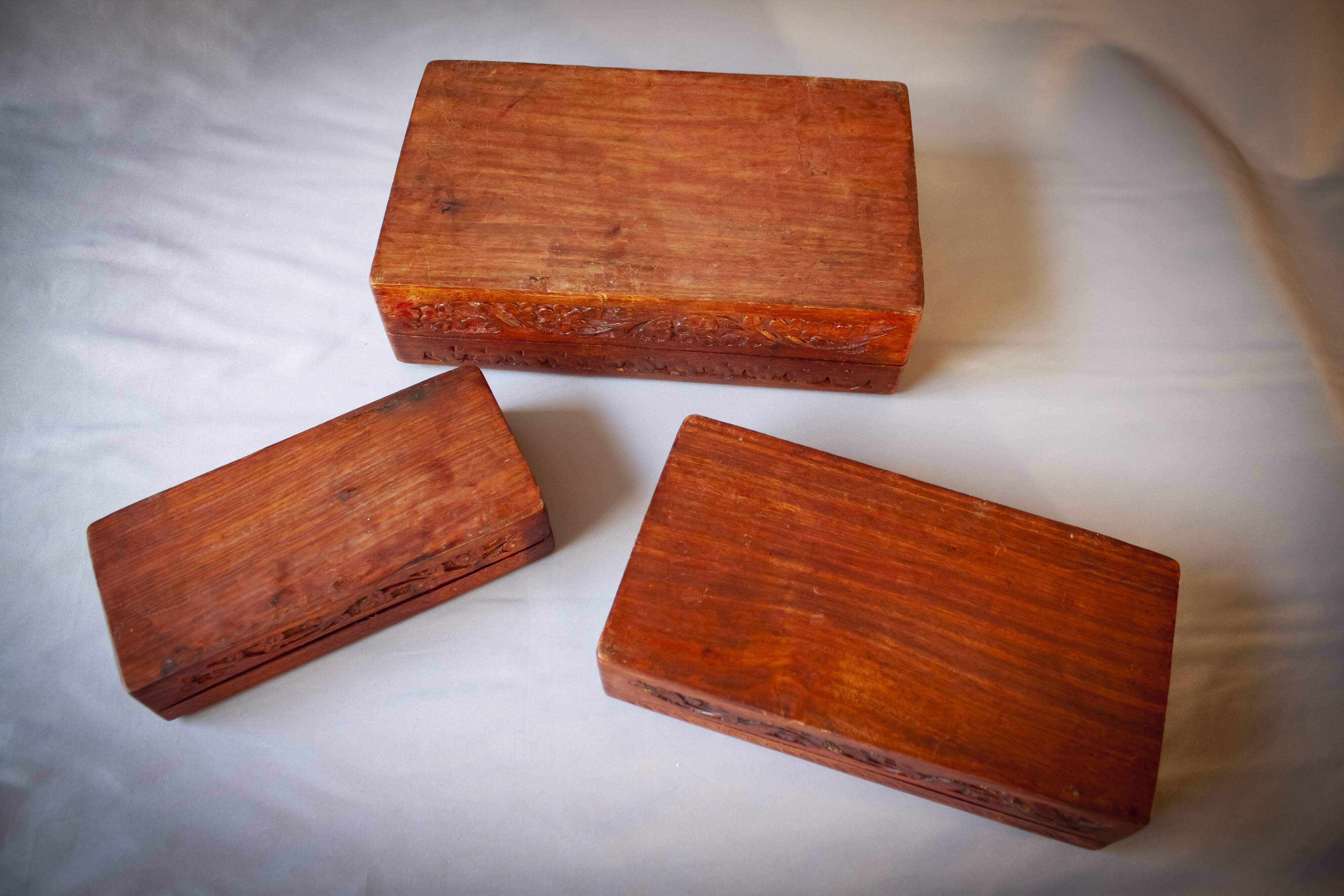 Antique hand-carved wooden boxes.