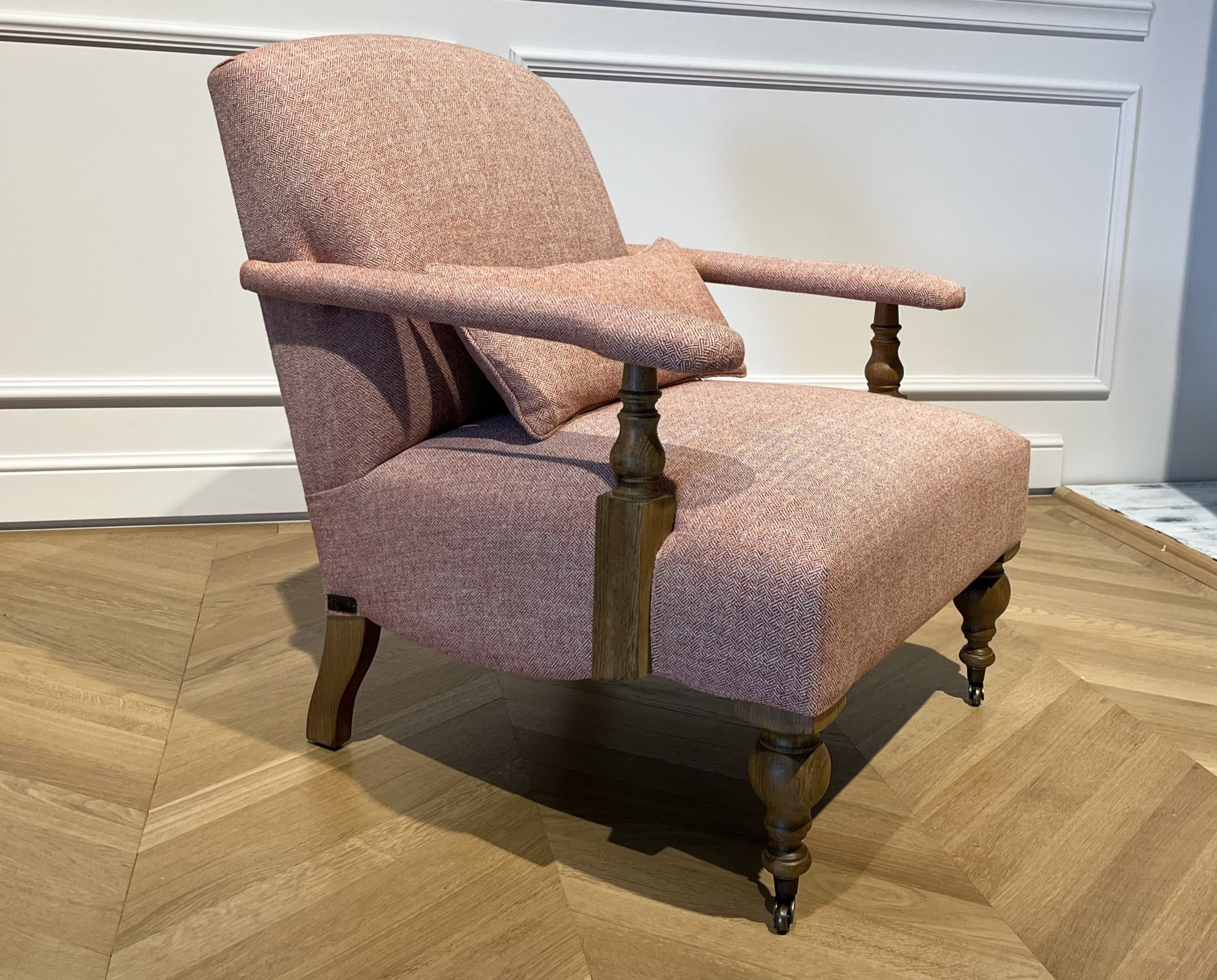 Wooden and red chevron fabric armchair with casters