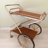 Rolling trolley in gold metal