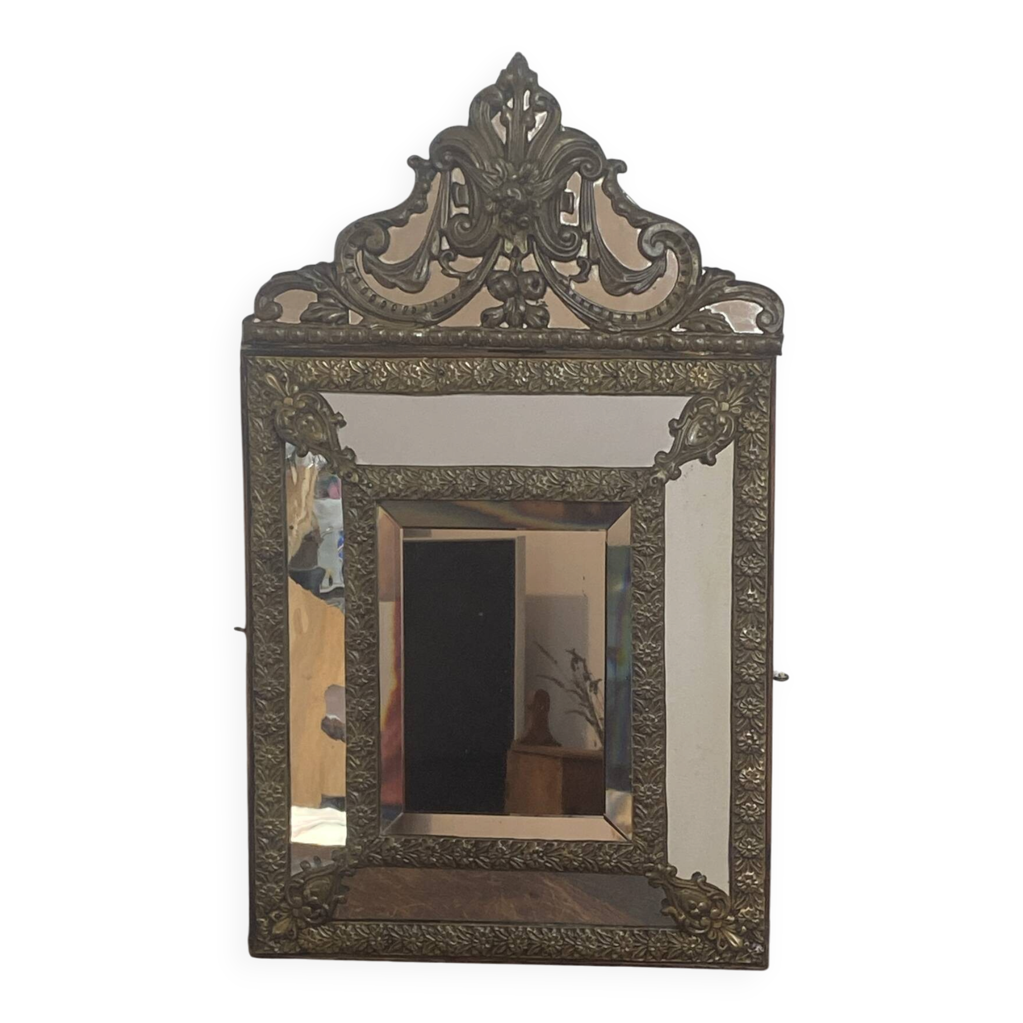 Mirror with brass repoussé frame