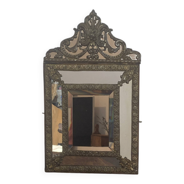Mirror with brass repoussé frame