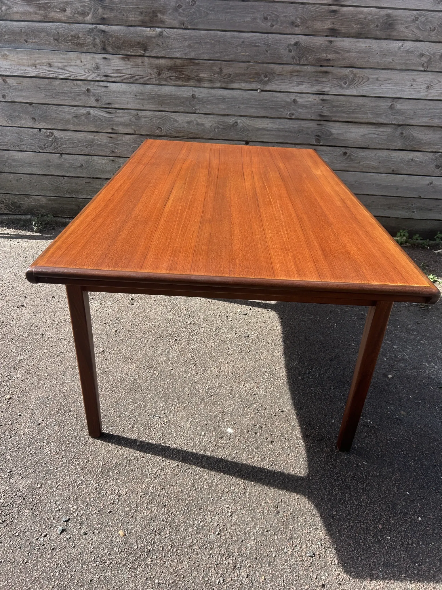 Rectangular extendable table in Scandinavian style made of teak.