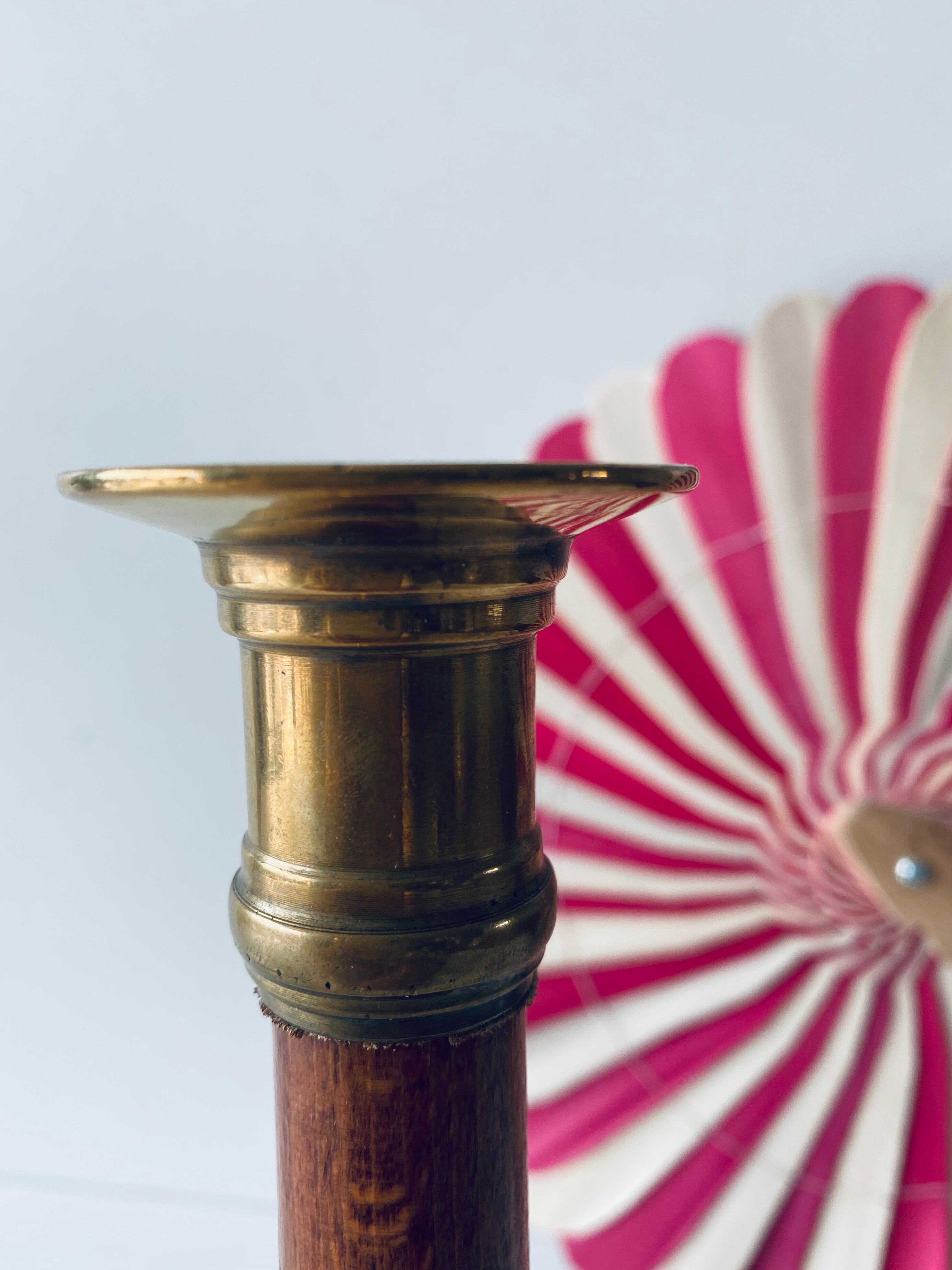 Old candle holder in brass and wood