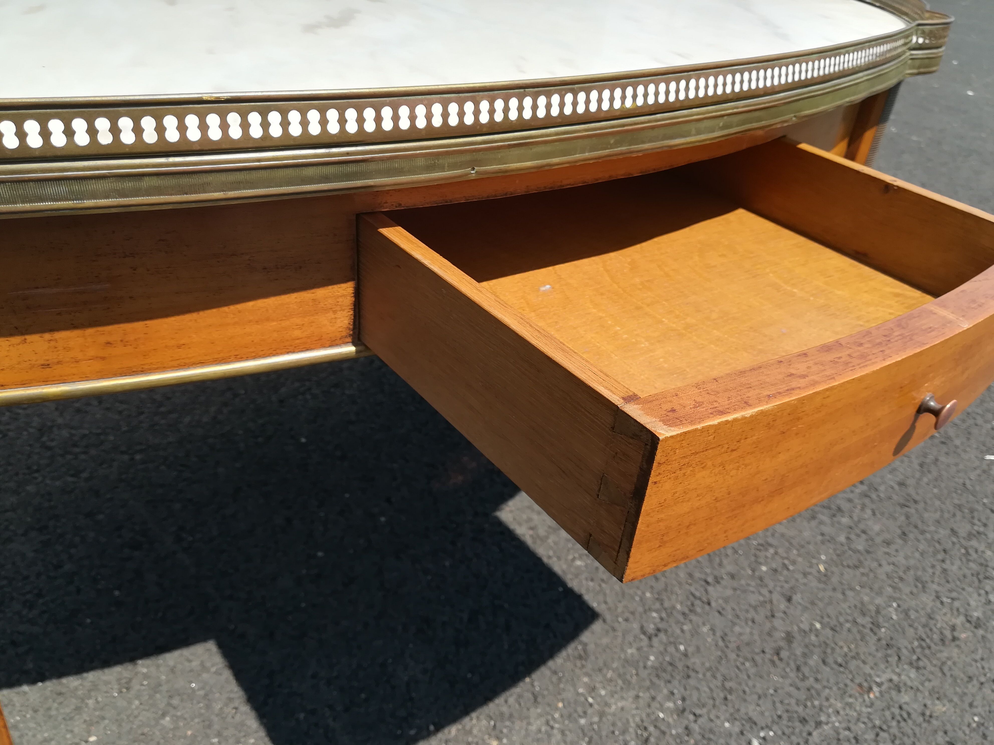 Oval marble and wood coffee table