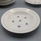 12 assiettes creuses, décor floral et liseré doré - ∅ : 23cm
