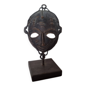 African bronze mask on pedestal, from Ivory Coast, dating