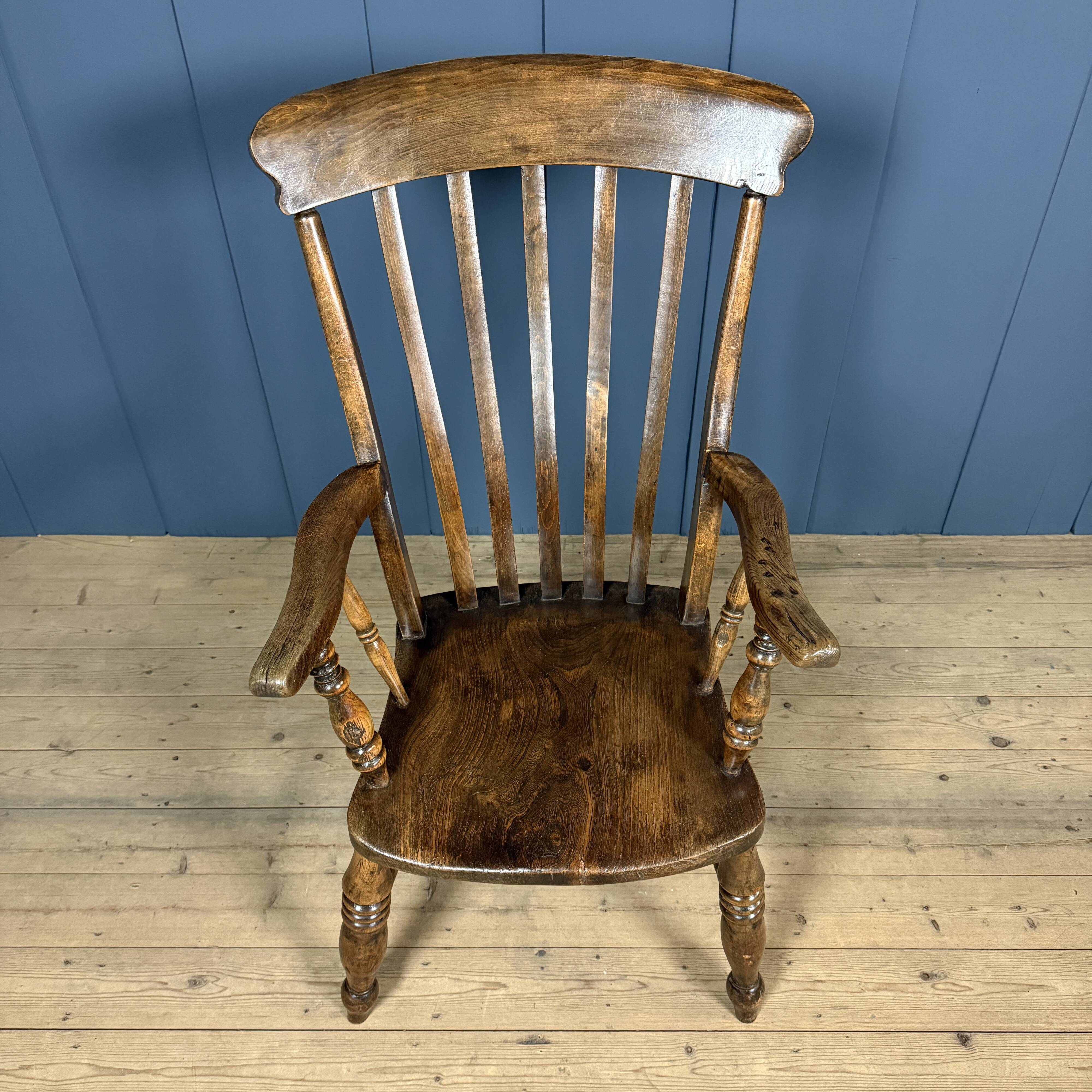 Brown English Windsor armchair with high back