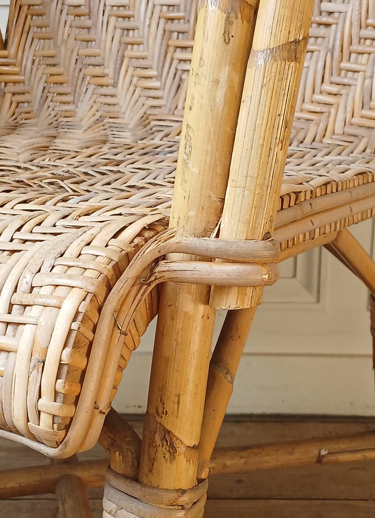 High-backed adult rattan armchair, circa 1960