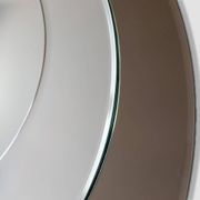 Round brown glass wall mirror attributed to Cristal Art, Italy, 1970s.