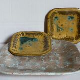 Set of three potter's plates in enamelled earth