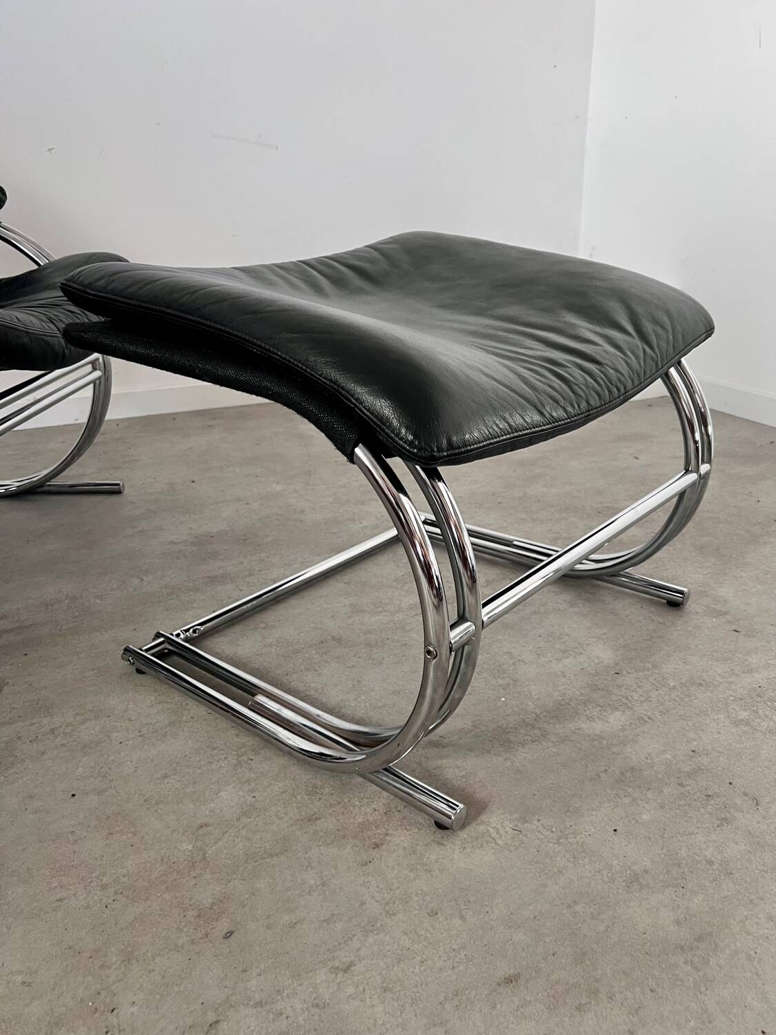 Old armchair and ottoman black leather tubular chrome bauhaus design from the 70s