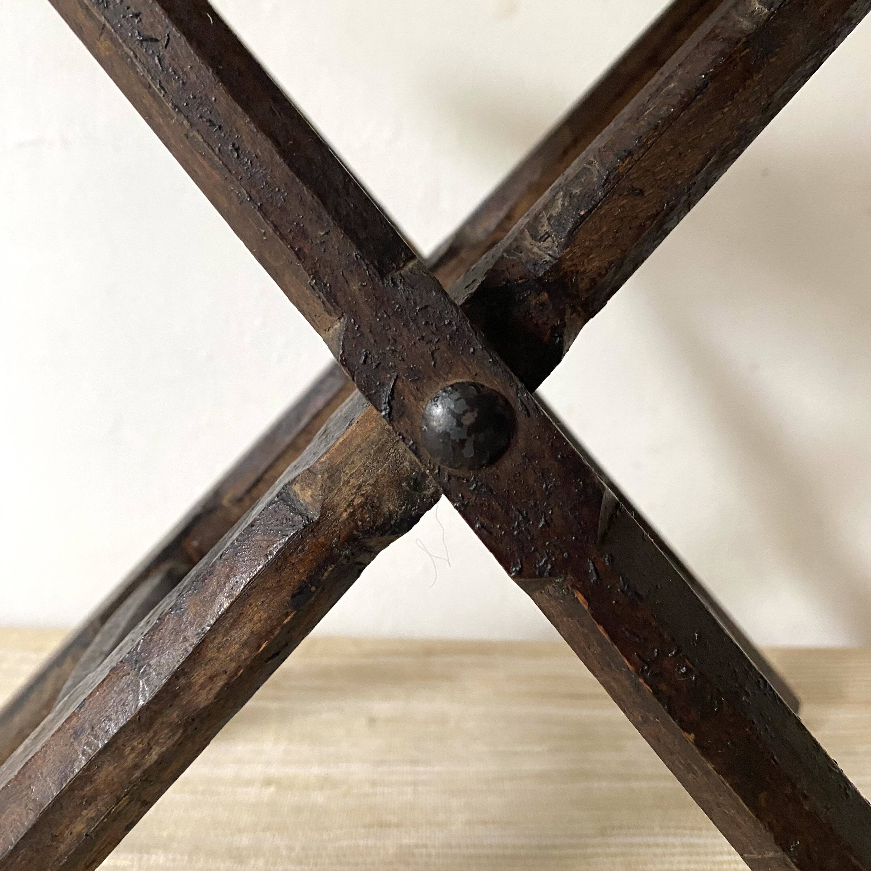 Folding slatted wooden stool