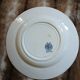 13 mismatched flat plates in ironstone