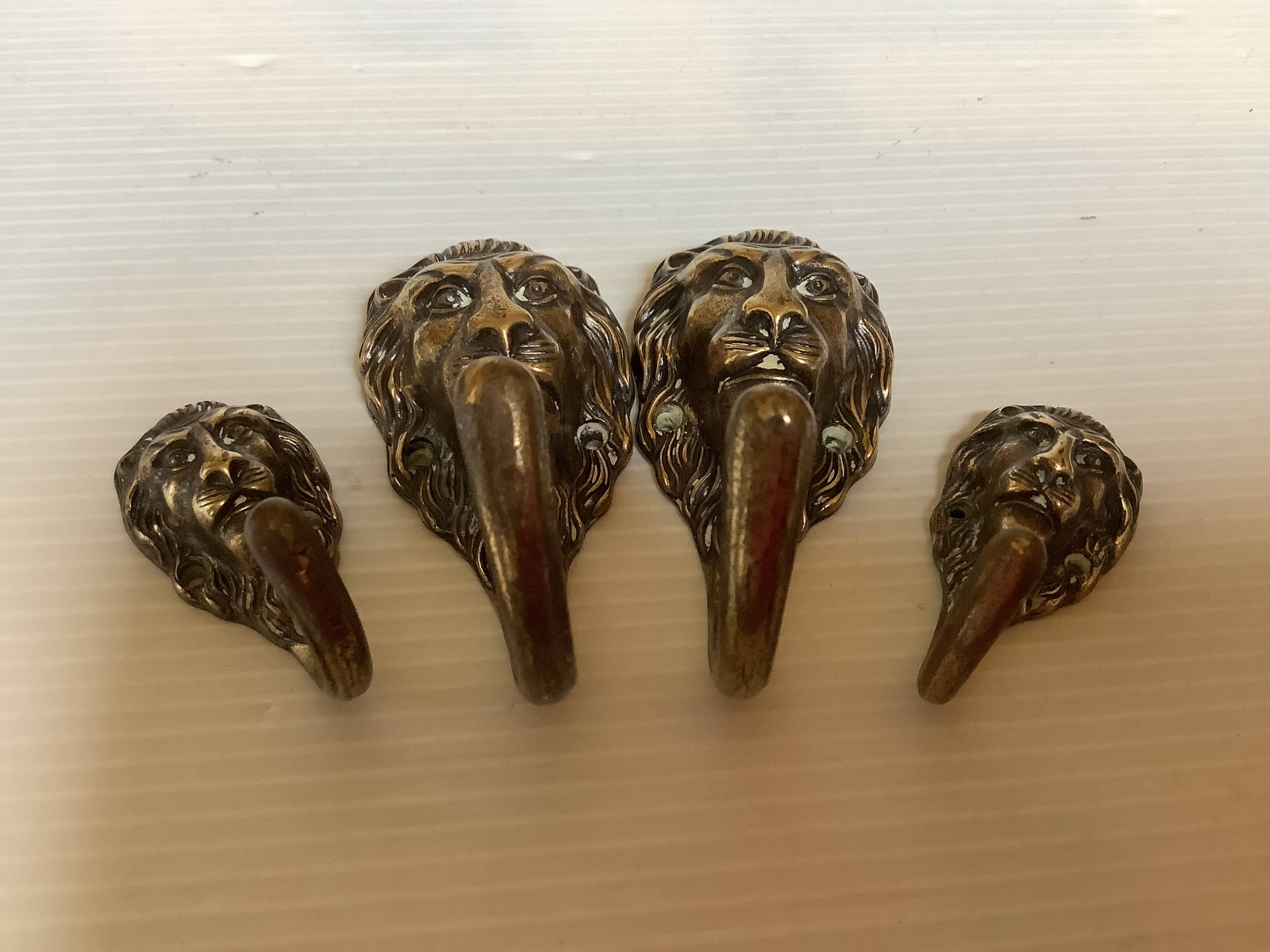 4 lion coat hooks in brass