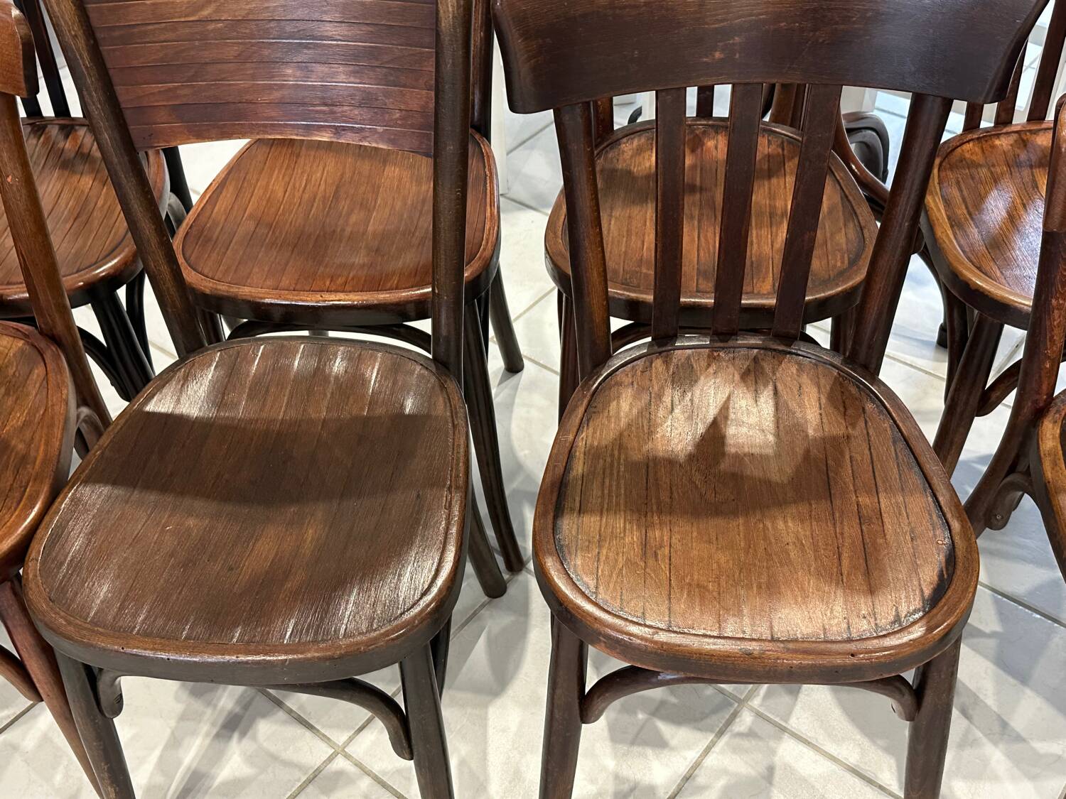 Set of 12 mismatched bistro chairs Baumann & Fischel 1930