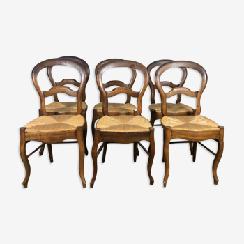 Suite de 6 chaises Louis Philippe paillées en noyer