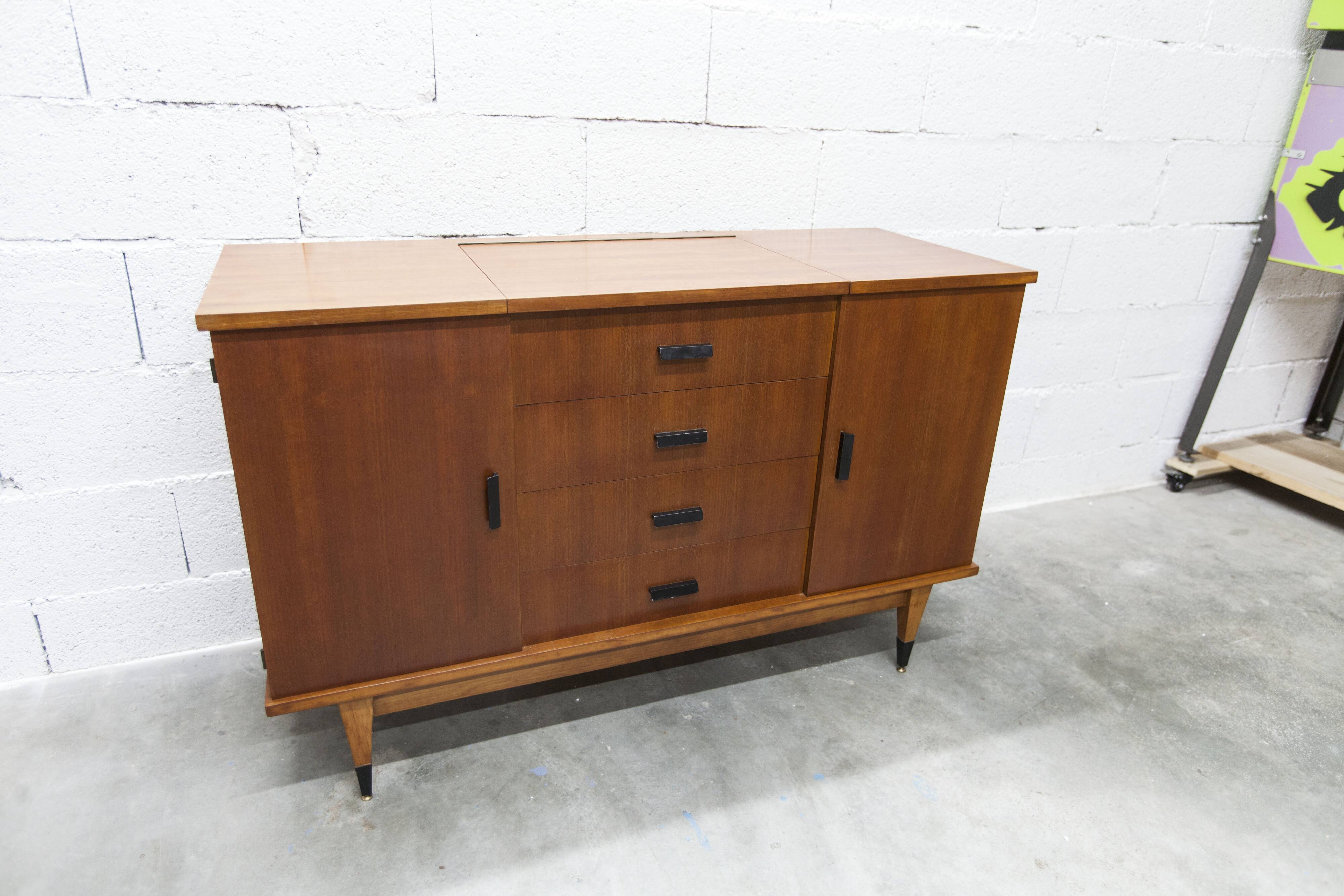1960s teak sideboard with 4 drawers, 2 doors, and a mirror.