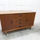 1960s teak sideboard with 4 drawers, 2 doors, and a mirror.