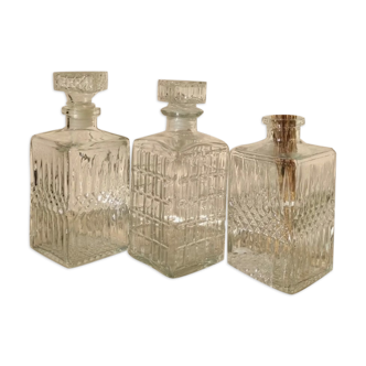 Trio of vintage chiseled glass decanters