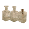 Trio of vintage chiseled glass decanters