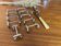 Set of 11 silver-plated metal knife holders, 1960