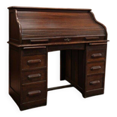 Vintage American wooden desk with a roll-top.