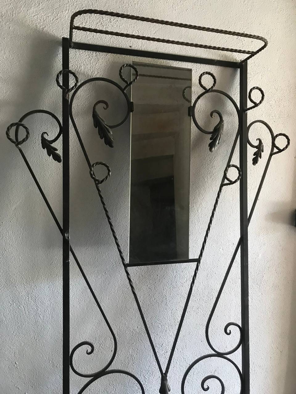 Wrought iron coat rack and shelf