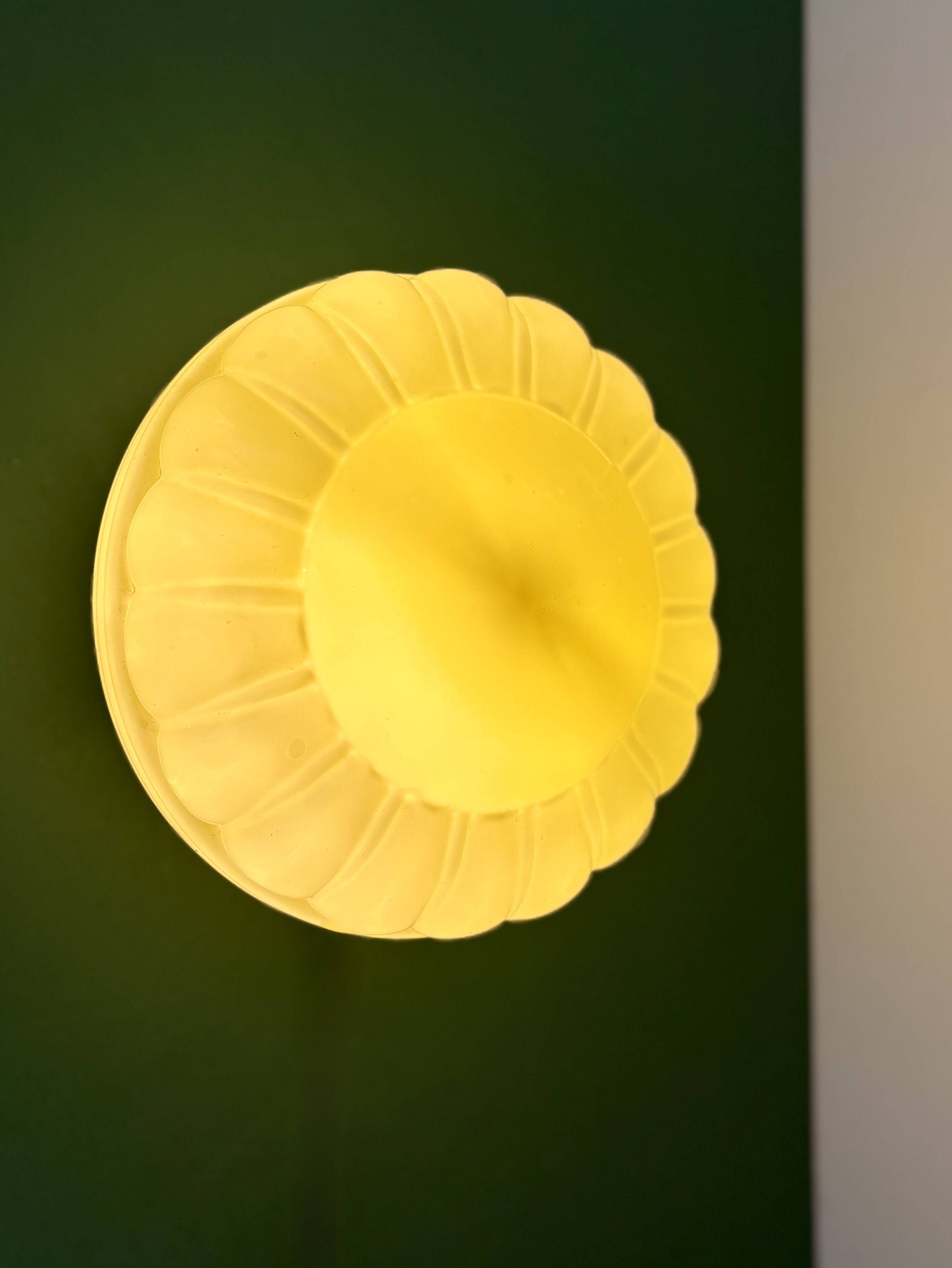 Vintage Art Deco globe wall or ceiling light in yellow opaline.