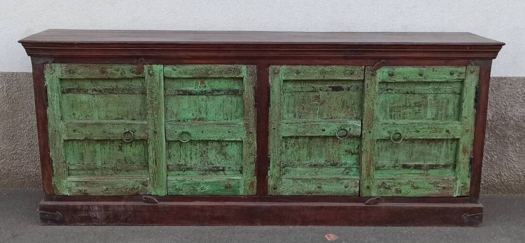 Long wooden sideboard with old green doors