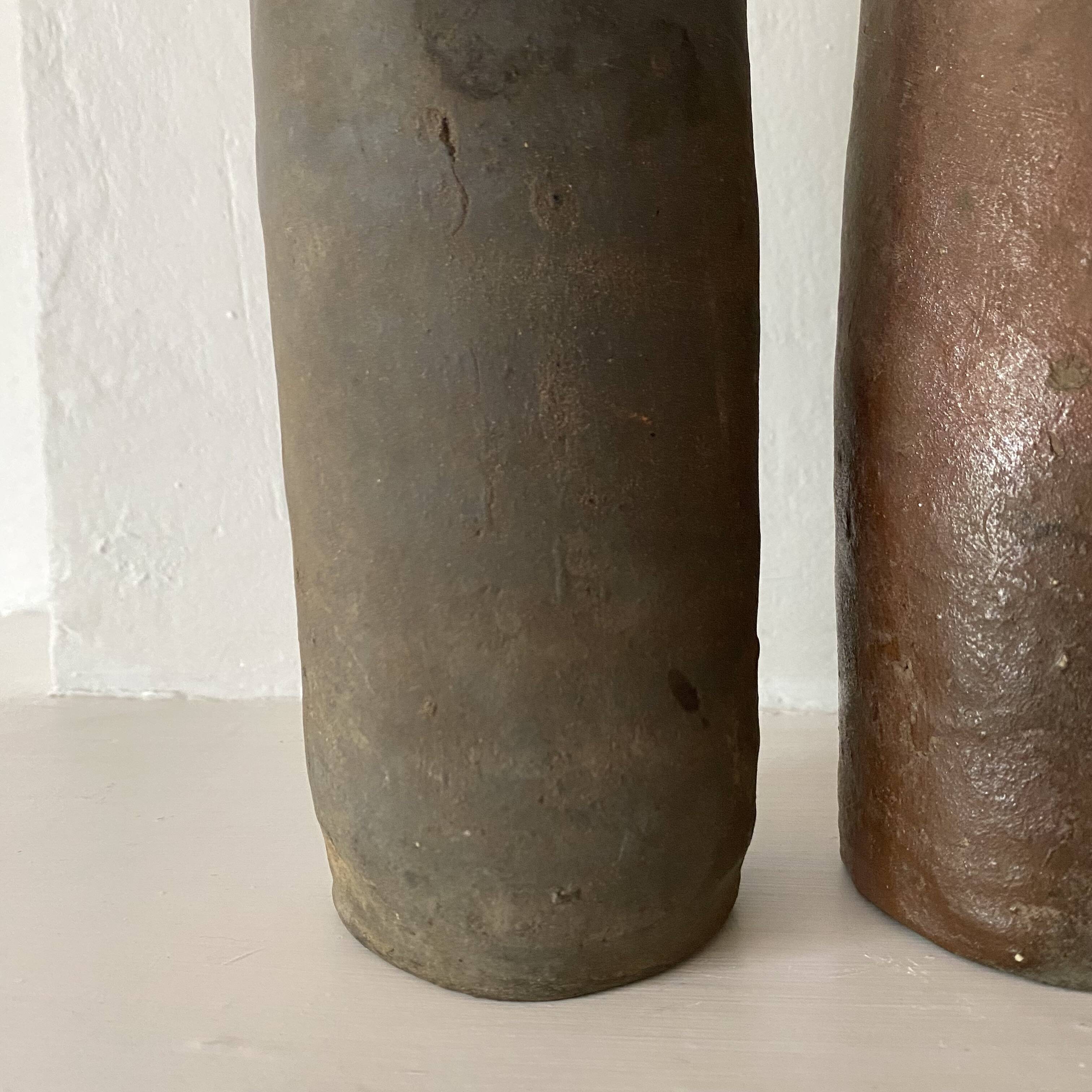 Antique terracotta cider bottles