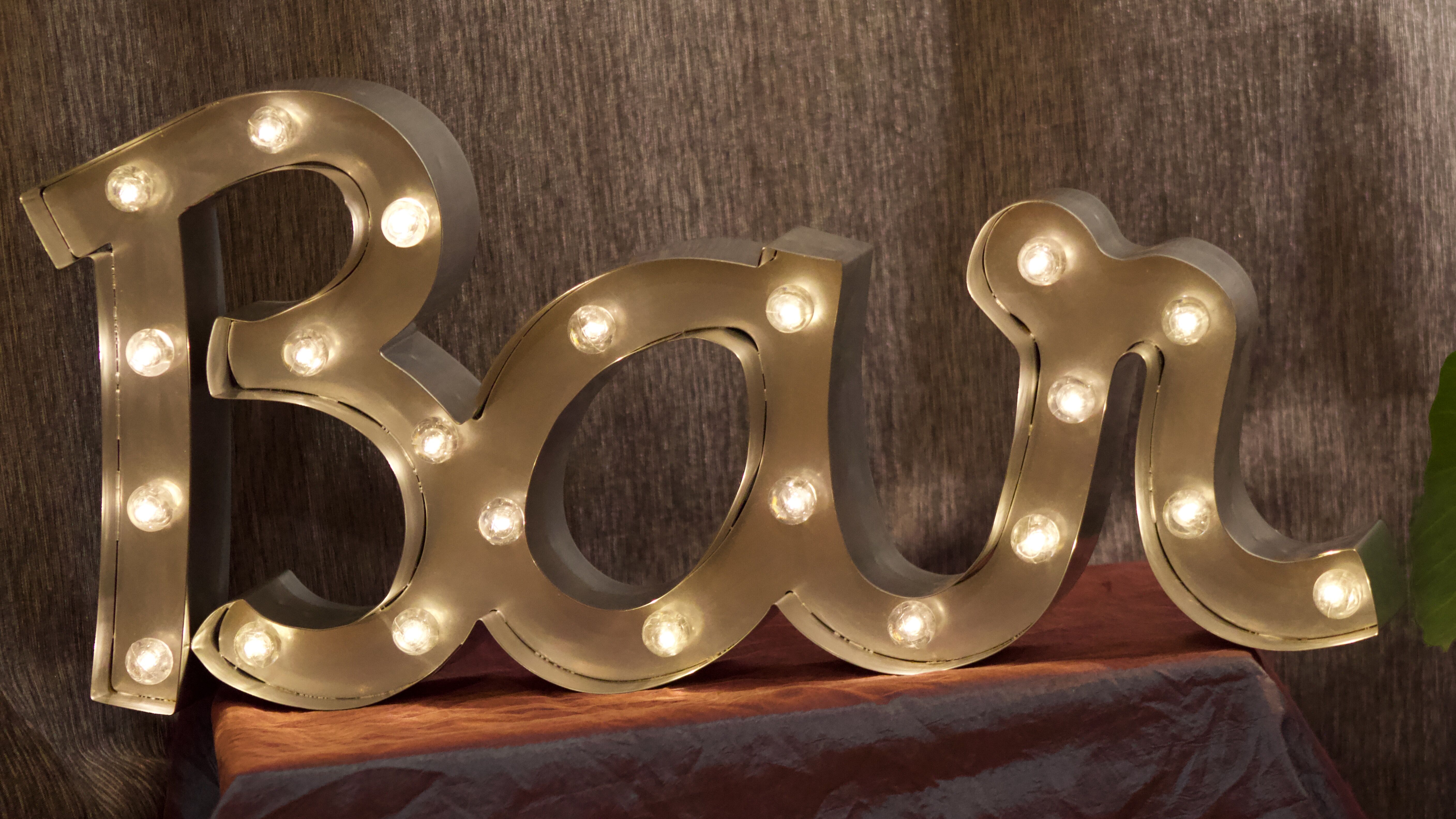 Ancient Light Sign in aluminium lettering forming the word "BAR"